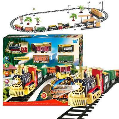 Железнодорожные приключения 36988 (10) "WToys", ОСВУЧЕНИЕ УКРАИНСКИМ ЯЗЫКОМ, 30 деталей, подсветка, песня, парогенератор, автоматическое движение, 4 вагона, декорации, платформа, в коробке